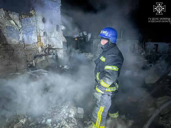 A Ukrainian firefighter at the scene of the Odesa drone strike.