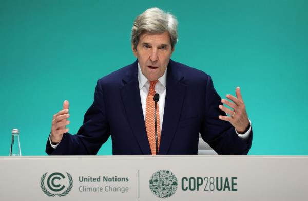 U.S. Climate Envoy John Kerry speaks during a press conference, after a draft of a negotiation deal was released, at the United Nations Climate Change Co<em></em>nference COP28 in Dubai on Dec. 13, 2023.