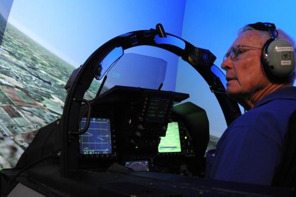 Retired Lt. Col. Robert Pardo surveys the surrounding area while in the F-15E Strike Eagle simulator at Seymour Johnson Air Force ba<em></em>se, North Carolina, Oct. 14, 2014.