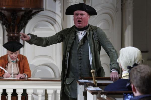 An actor delivers a line as founding father John Hancock during Saturday's celebration.