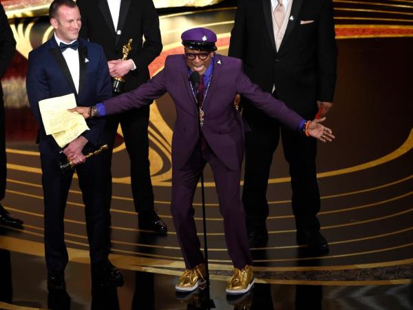 Filmmaker Spike Lee is seen wearing the gold sneakers as he accepts an Oscar in 2019.