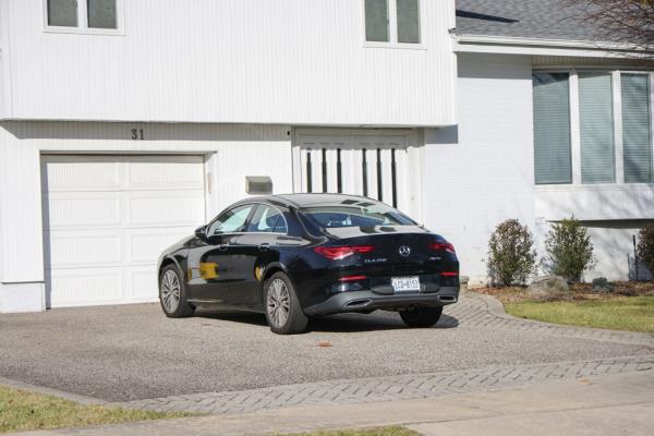 a Mercedes is parked in the driveway