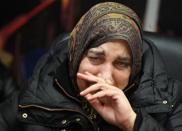 Photo of dead cop's mom crying.