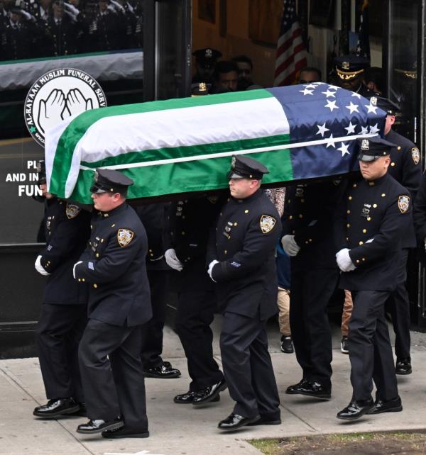 officers carry fayaz' flag draped coffin at his funeral