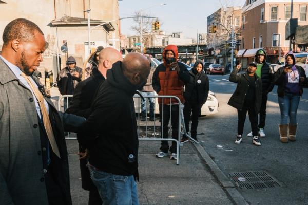 Danny Daniel is walked from the 81st precinct to a NYPD vehicle en route to Brooklyn Criminal Court. 